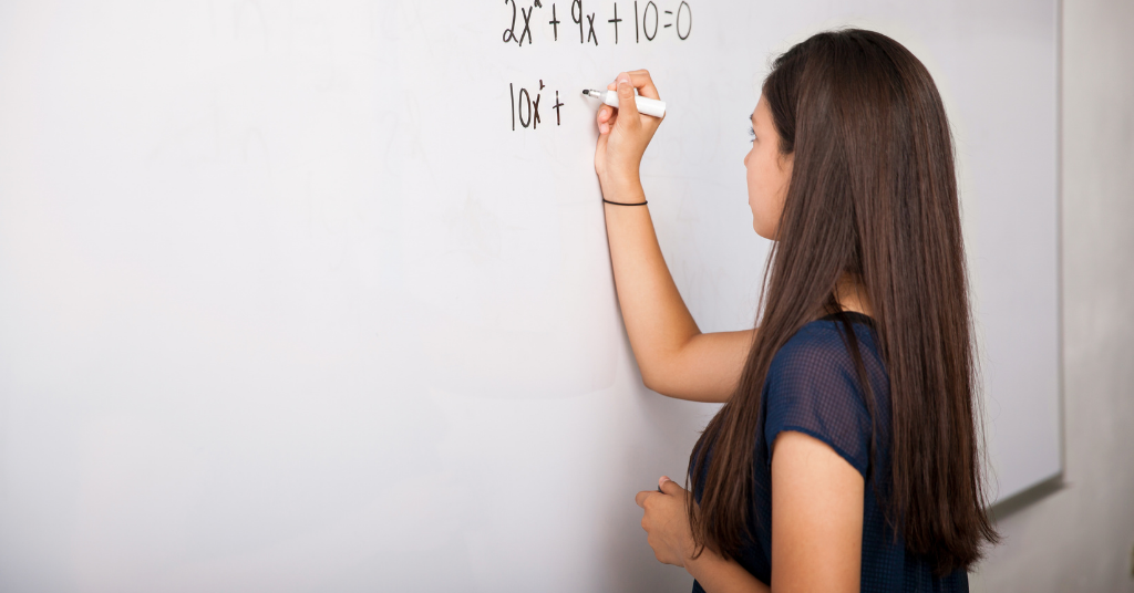girl solving a math equation
