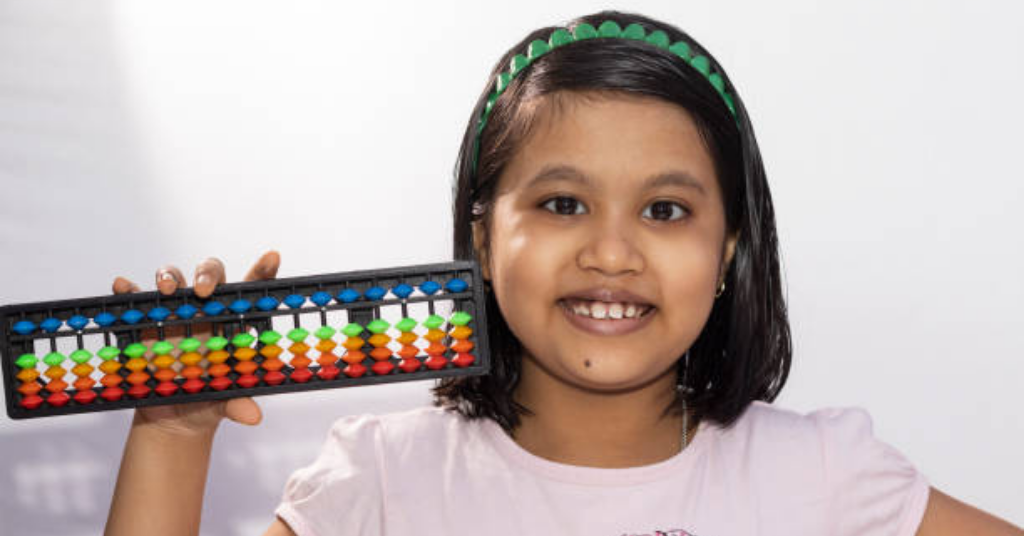 girl holding abacus