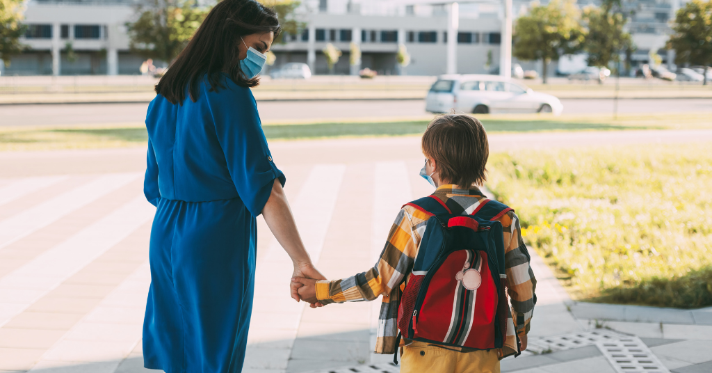 mother taking her child to school