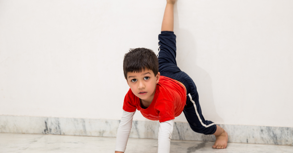 small boy doing yoga