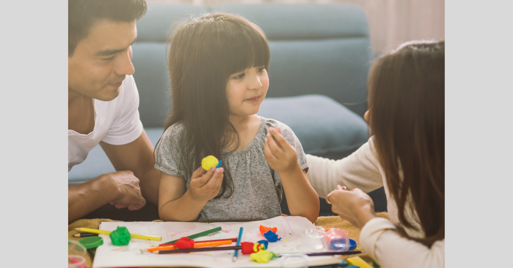 girl playing with her parents