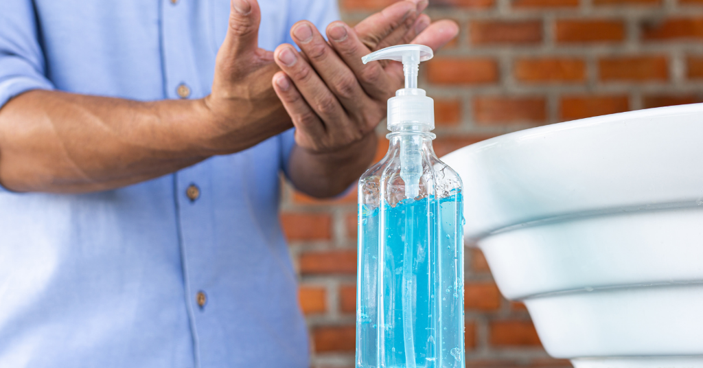 person sanitizing hands