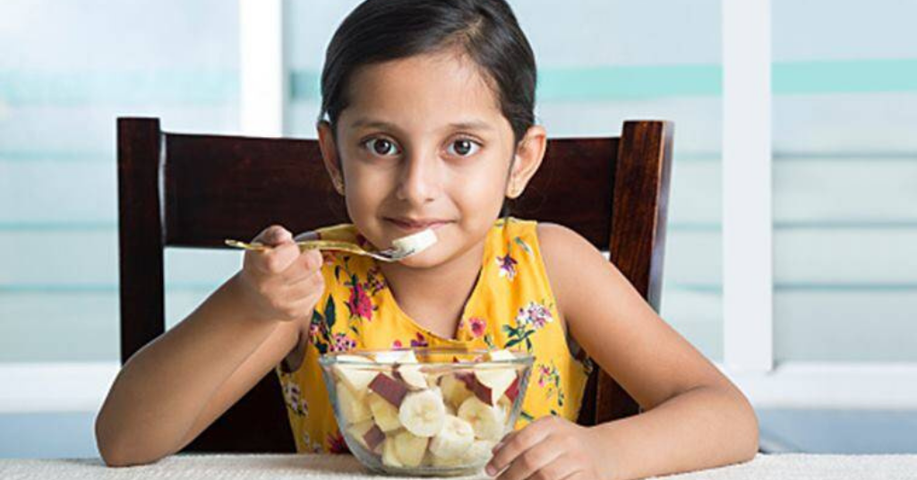 Indian girl eating healthy food