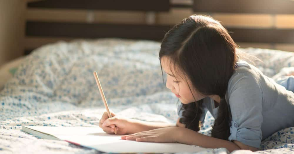 a girl writing her journal