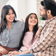 A family sitting together and discussing