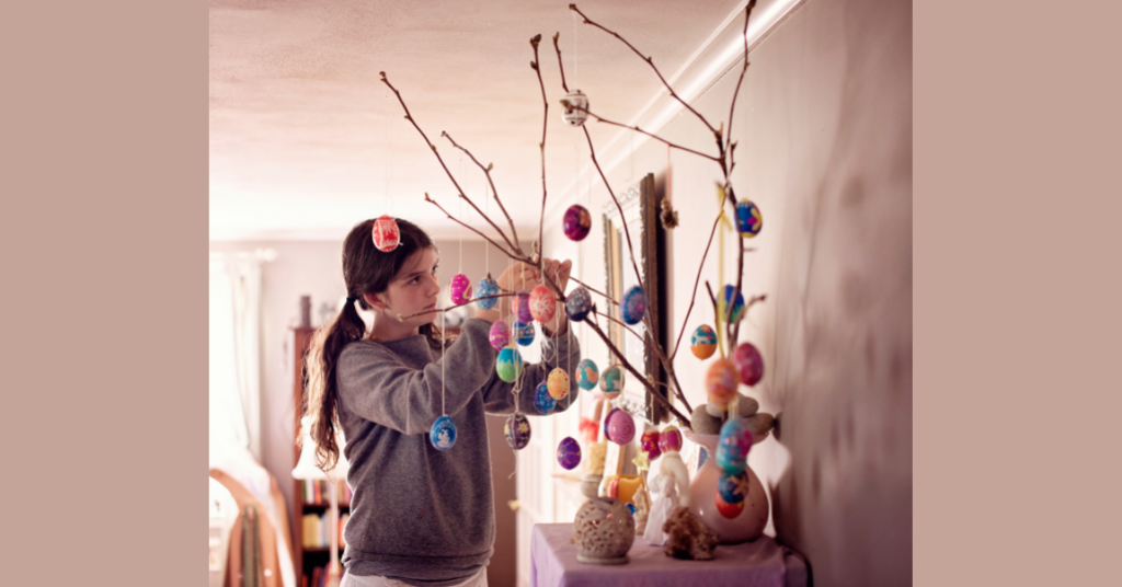 girl decorating an Easter tree