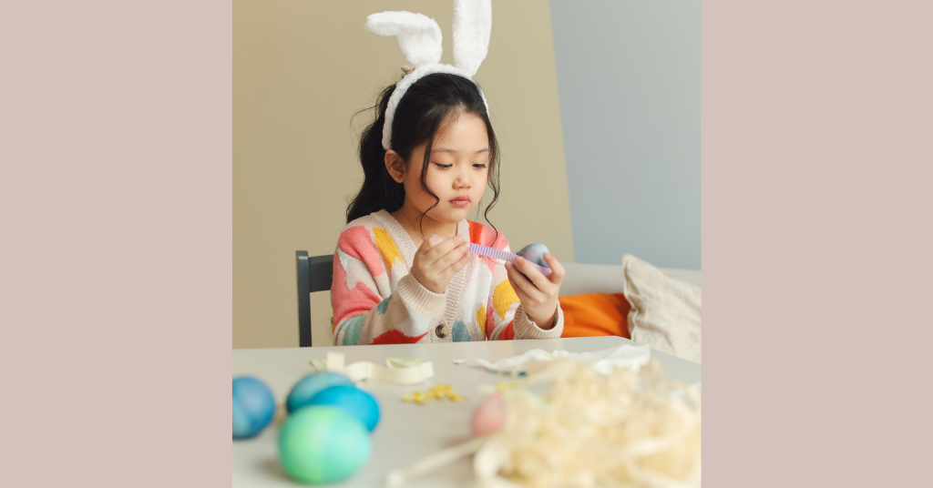 girl painting eggs