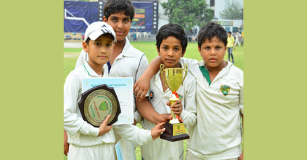 young boys showing their trophies after winning  a match