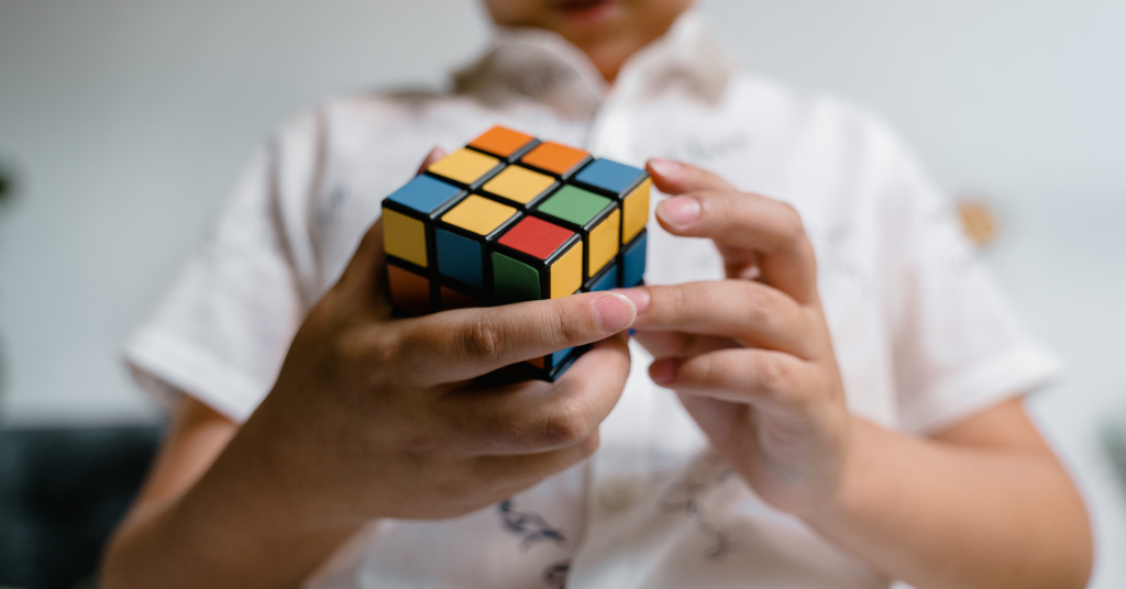 Child playing with a Rubik's cube