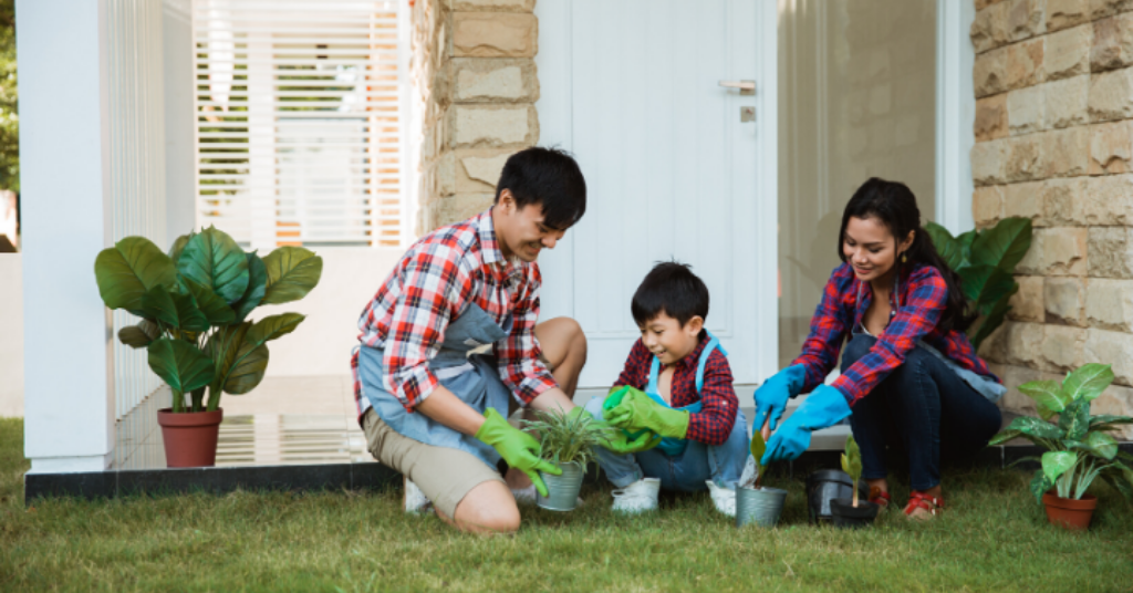 Parents and son gardening together