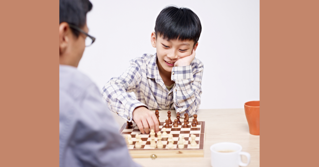 Father and son playing chess