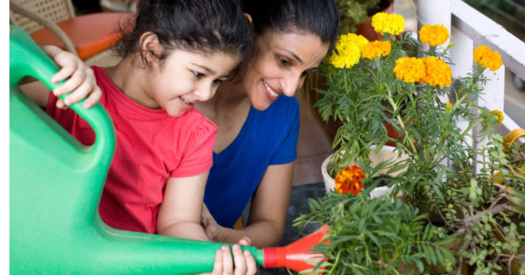 A mother is gardening with kid