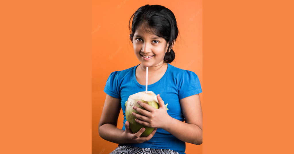 A girl drinking coconut water
