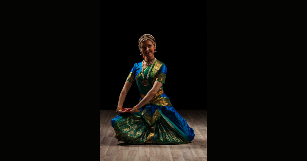 A girl is dancing on Indian form of dancing