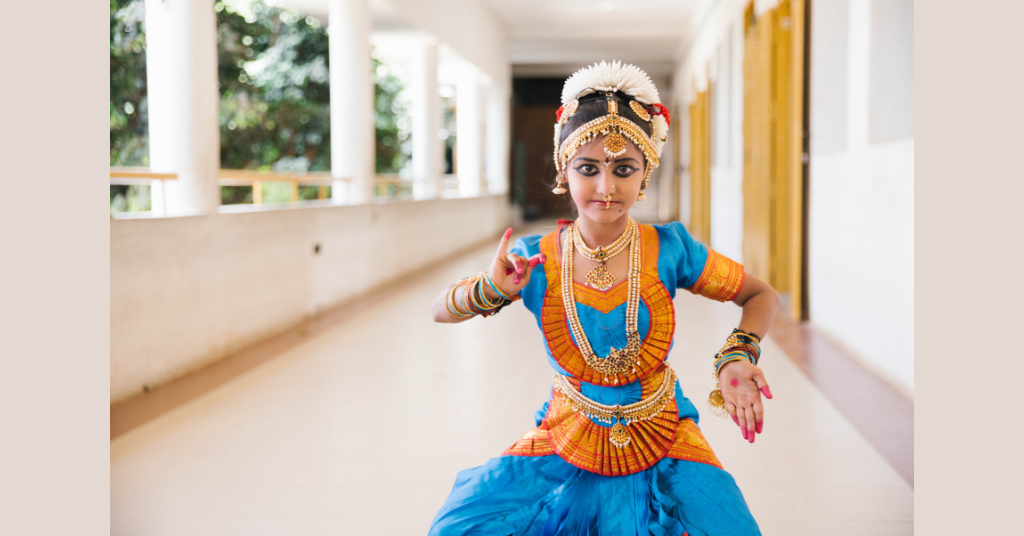 A girl is about to perform an Indian dance.