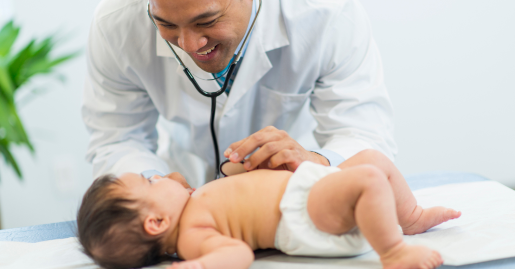 A pediatrician or child specialist checking the vitals of a child